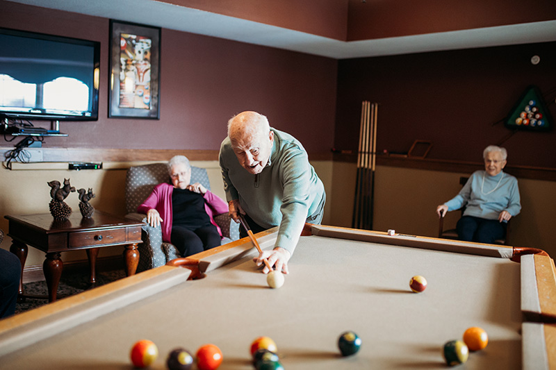 At Auburn Meadows in Waconia, an assisted living resident plays a game of pool